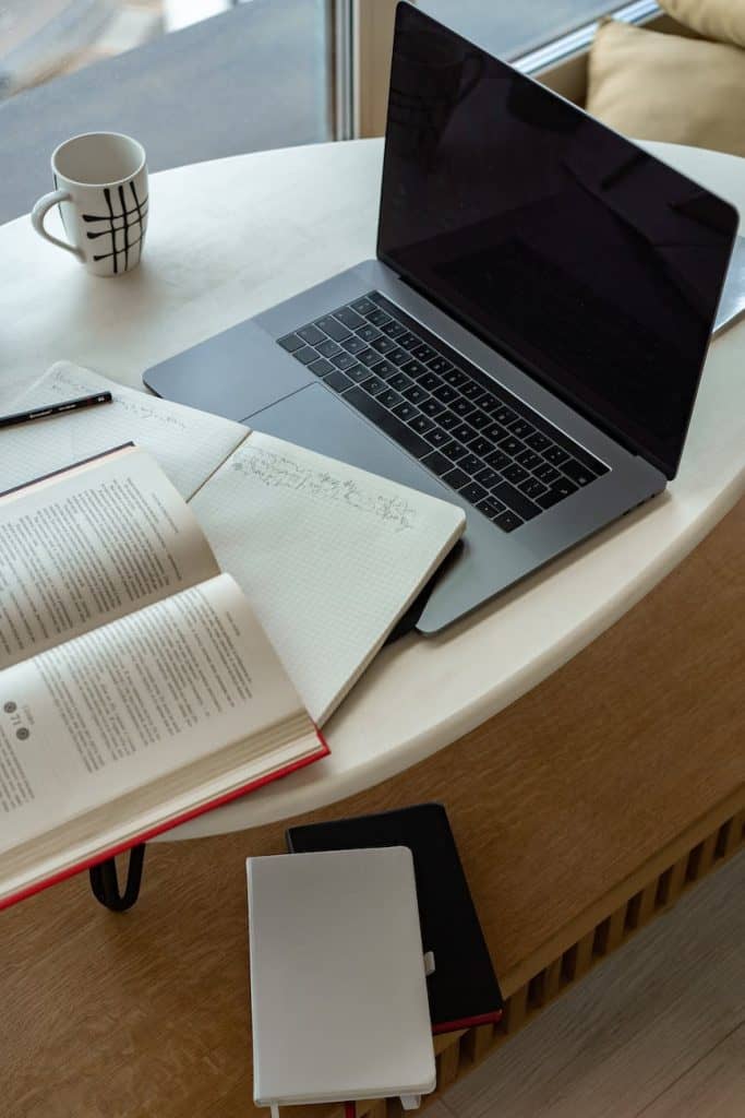 macbook pro on white table